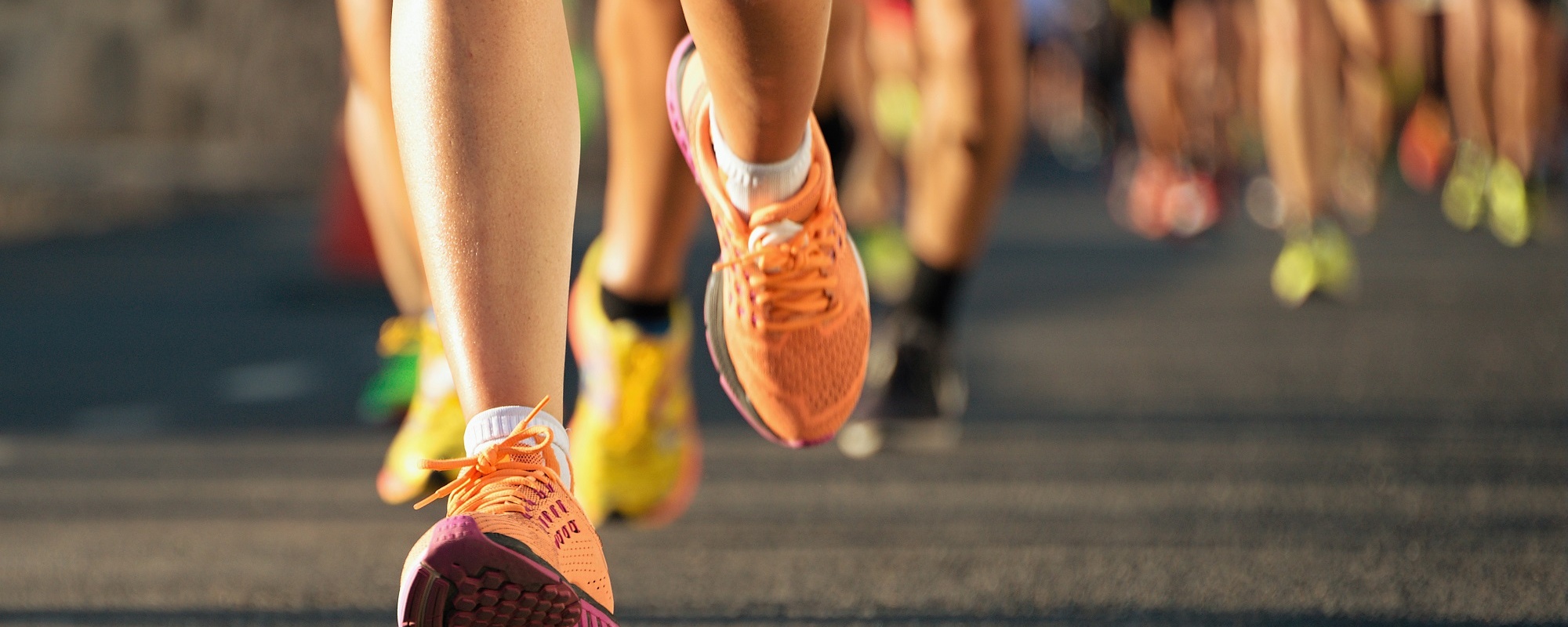 Several runners on asphalt